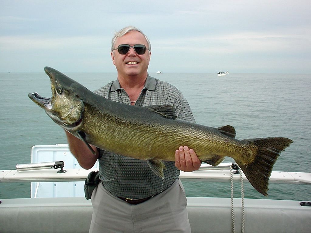 Gus, proudly showing a large steelhead he caught